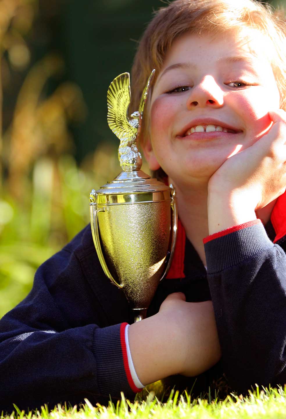 Boy holding trophy